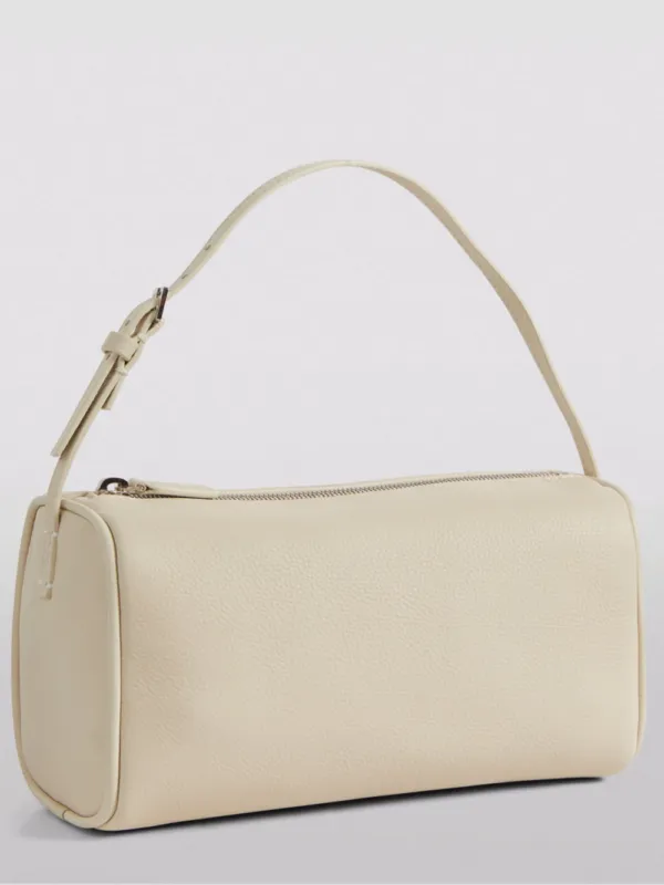 The Row 90's Leather Baguette Bag Ivory | Luxury and style at your fingertips