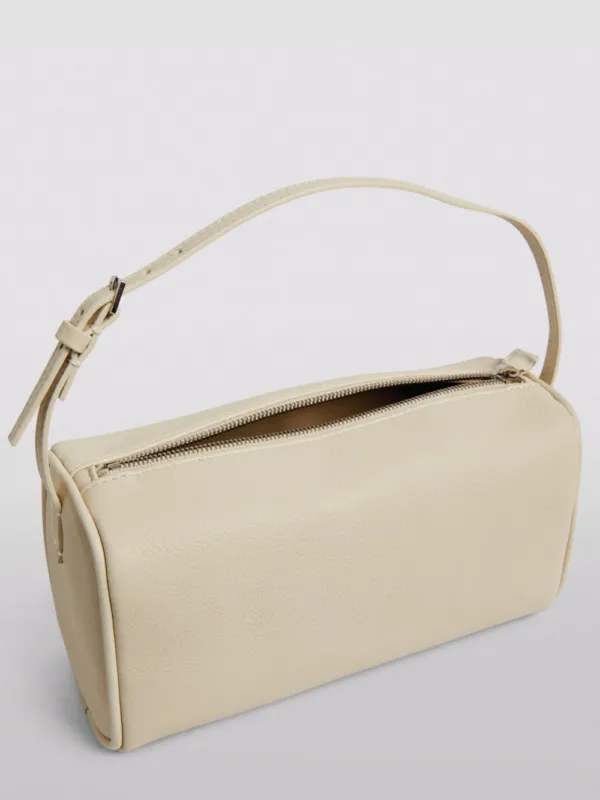 The Row 90's Leather Baguette Bag Ivory | Luxury and style at your fingertips